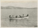 Image of Katie Hettasch and scholars in boat